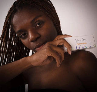 A woman applying the lotion bar from Flor y Amor's travel pack