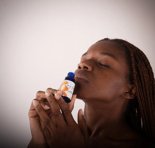 model smelling the Citrus Essential Oil Blend from Flor y Amor 18ml