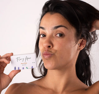 Model posing with the travel size Duo Pack Flor y Amor