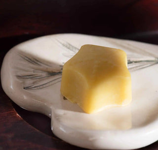 Cocoa ButterLip Balm  on a ceramic plate