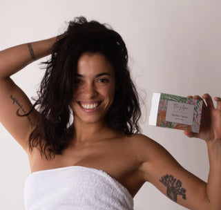 model holding our Flor y Amor - Tropical Mini pack - Pregnancy Safe Travel & Trial Size Skincare