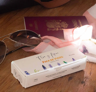 Flor y Amor's travel pack with passport and sunglasses
