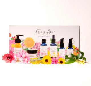 A curated botanical gift set from Flor y Amor, our 30 day facial ritual contains the entire facial ritual with box, photo in front of a floral background.